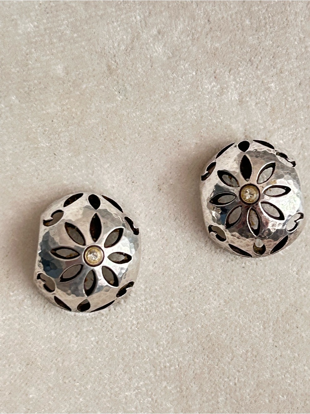 Brighton Collectibles earrings featuring a cutout flower dome design